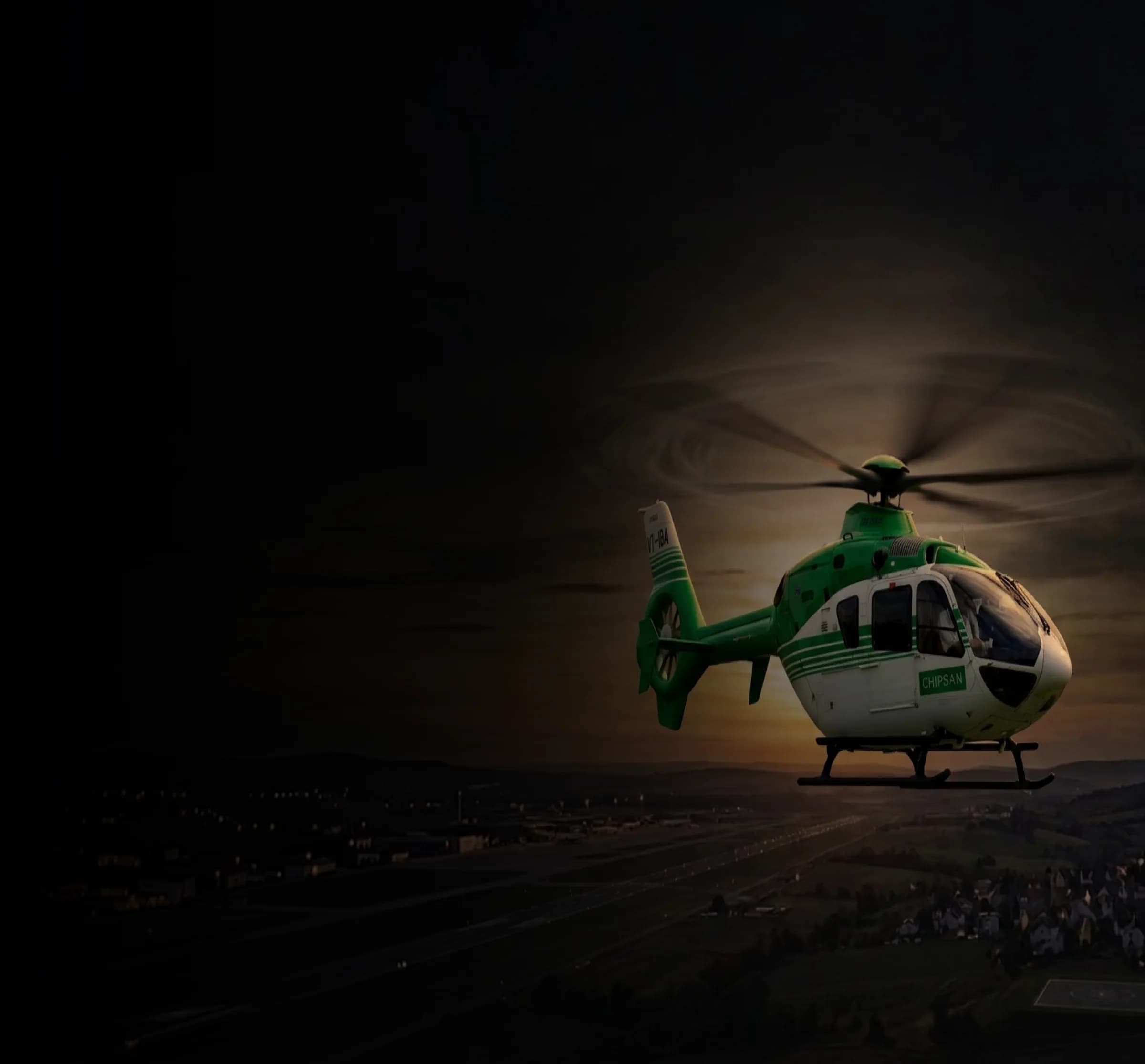 Zkyoma's green and white Airbus H135 in flight at dusk over Kochi